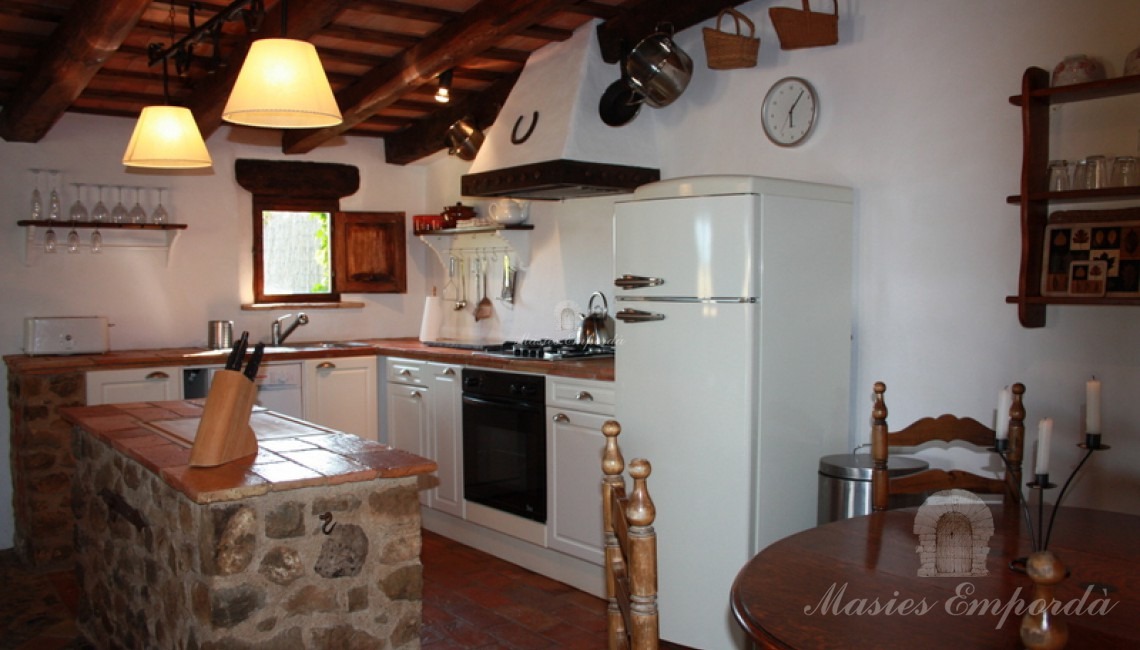 Salón de la casa de invitados con cocina americana Salón de la casa de invitados con cocina americana